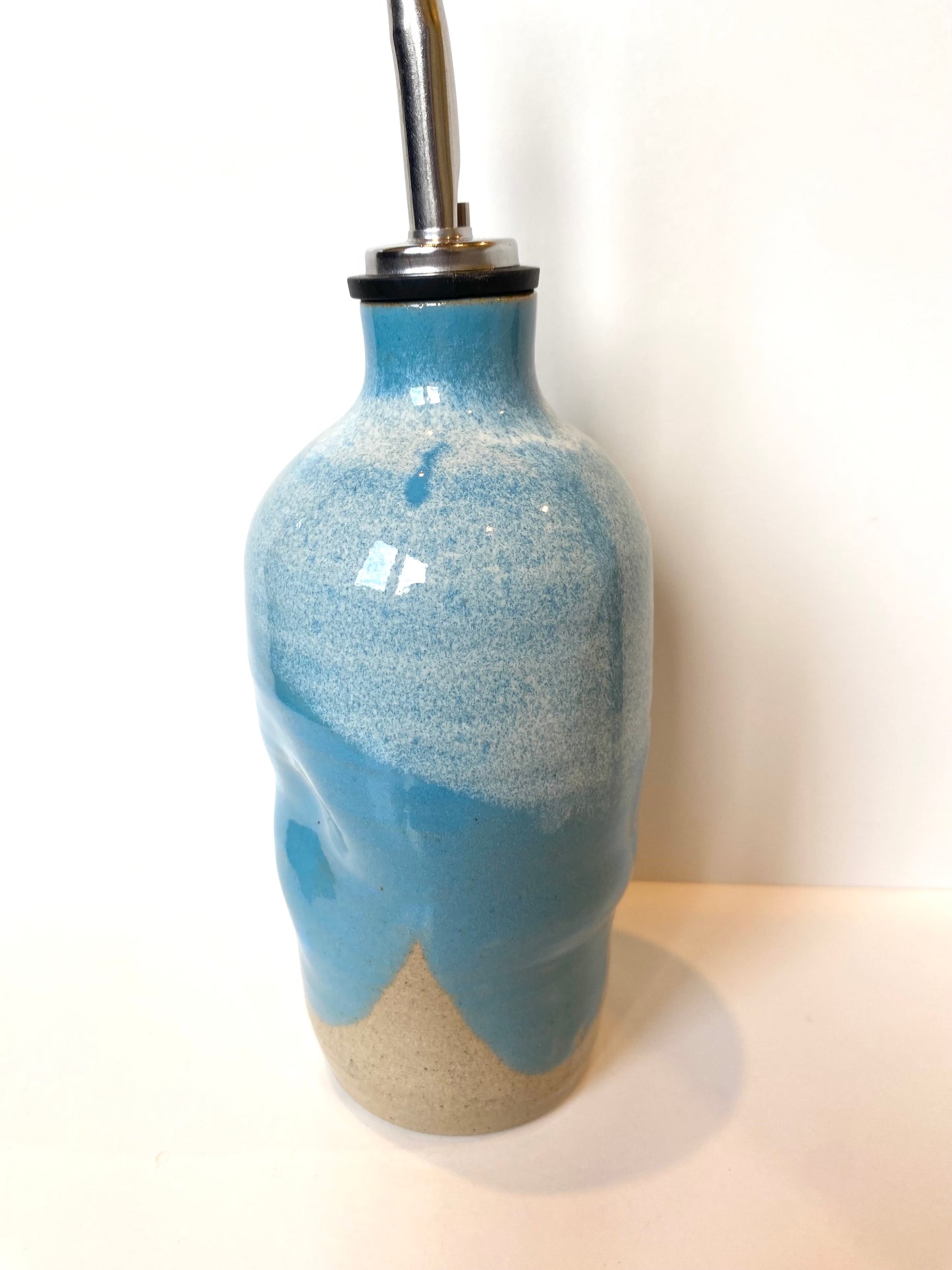 Turquoise oil bottle