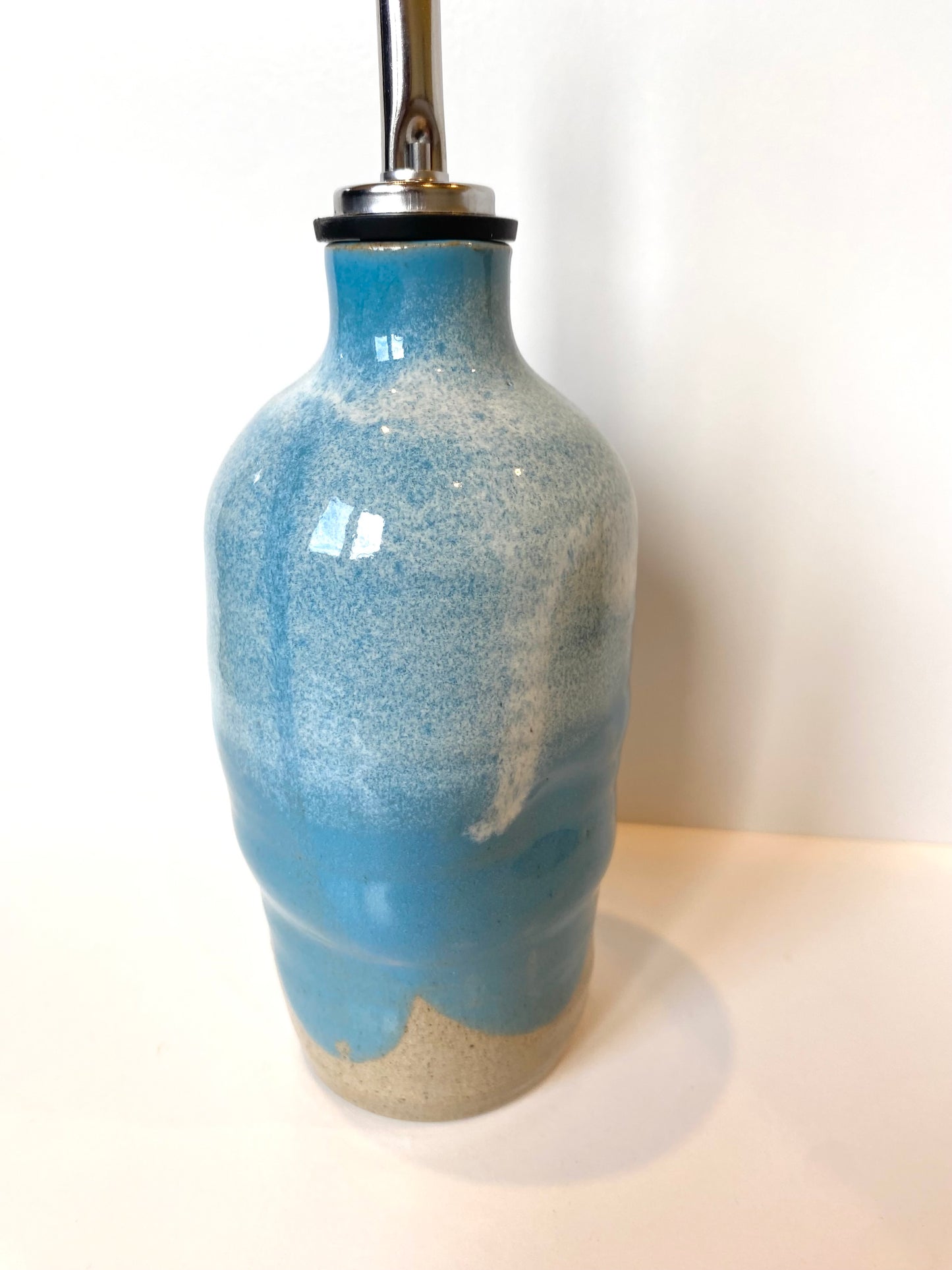 Turquoise oil bottle