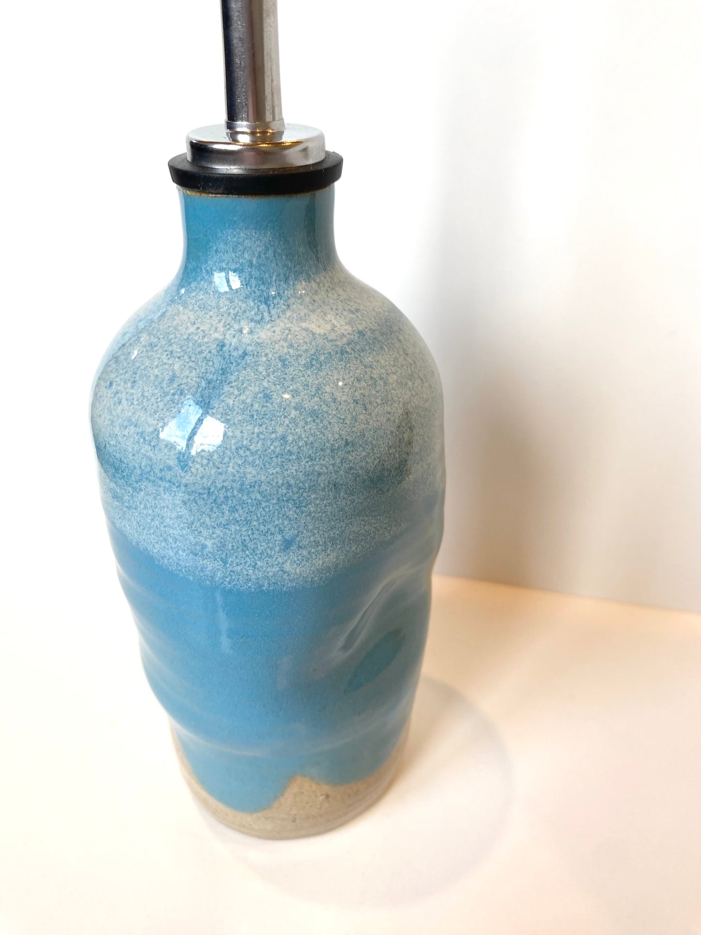 Turquoise oil bottle