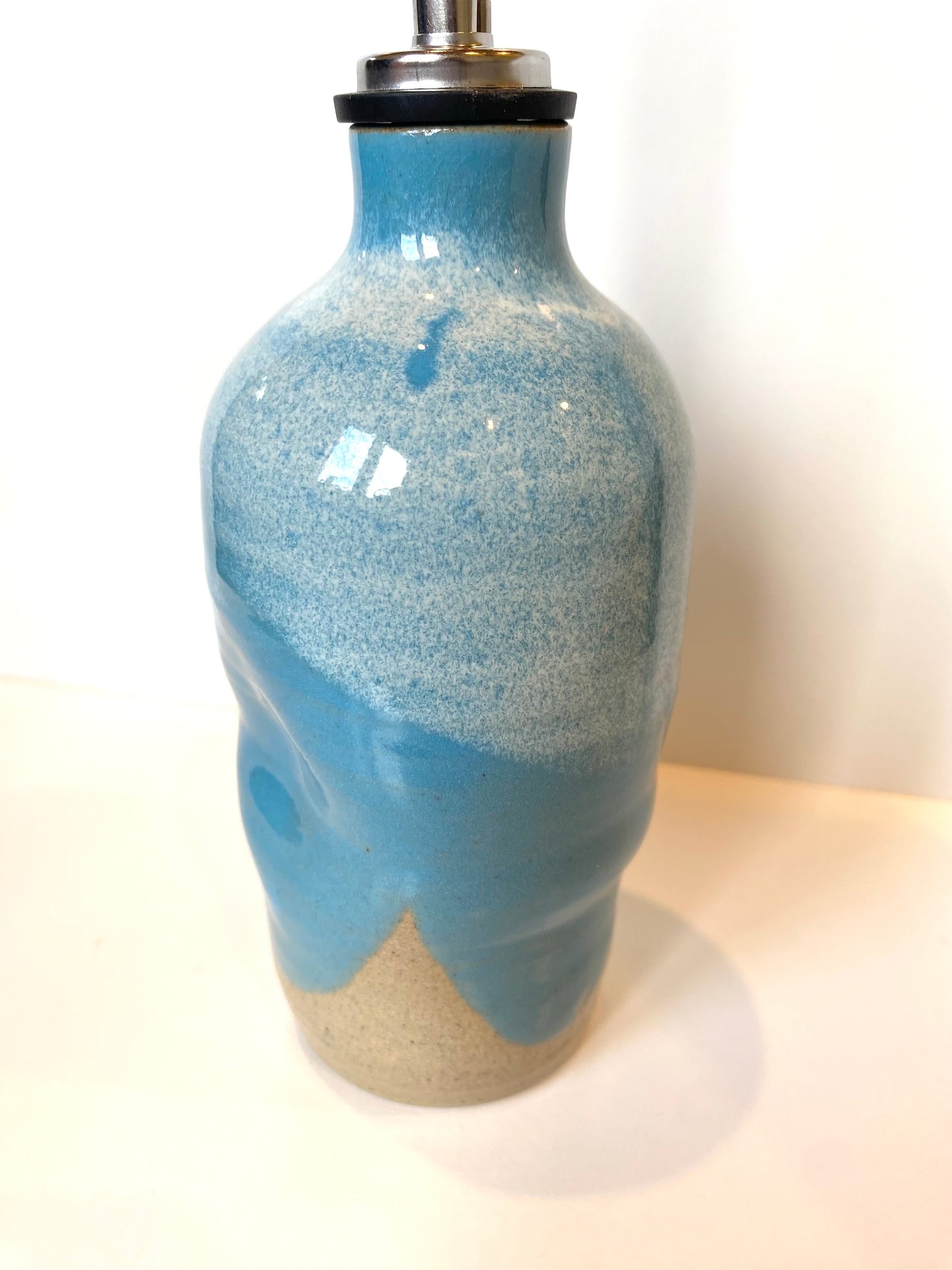Turquoise oil bottle