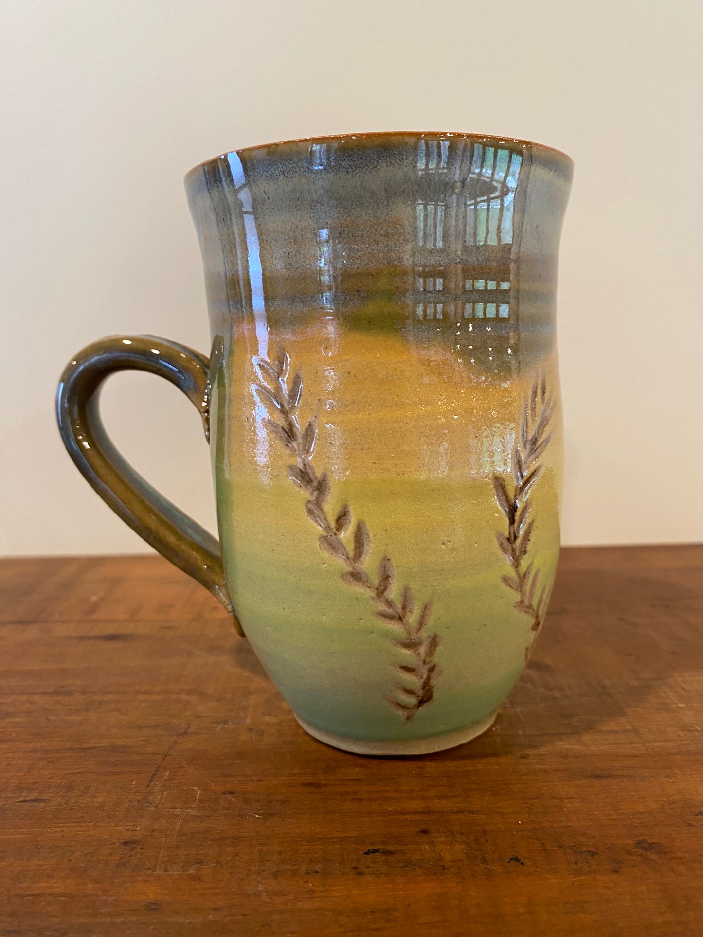 Leaf carved green mug