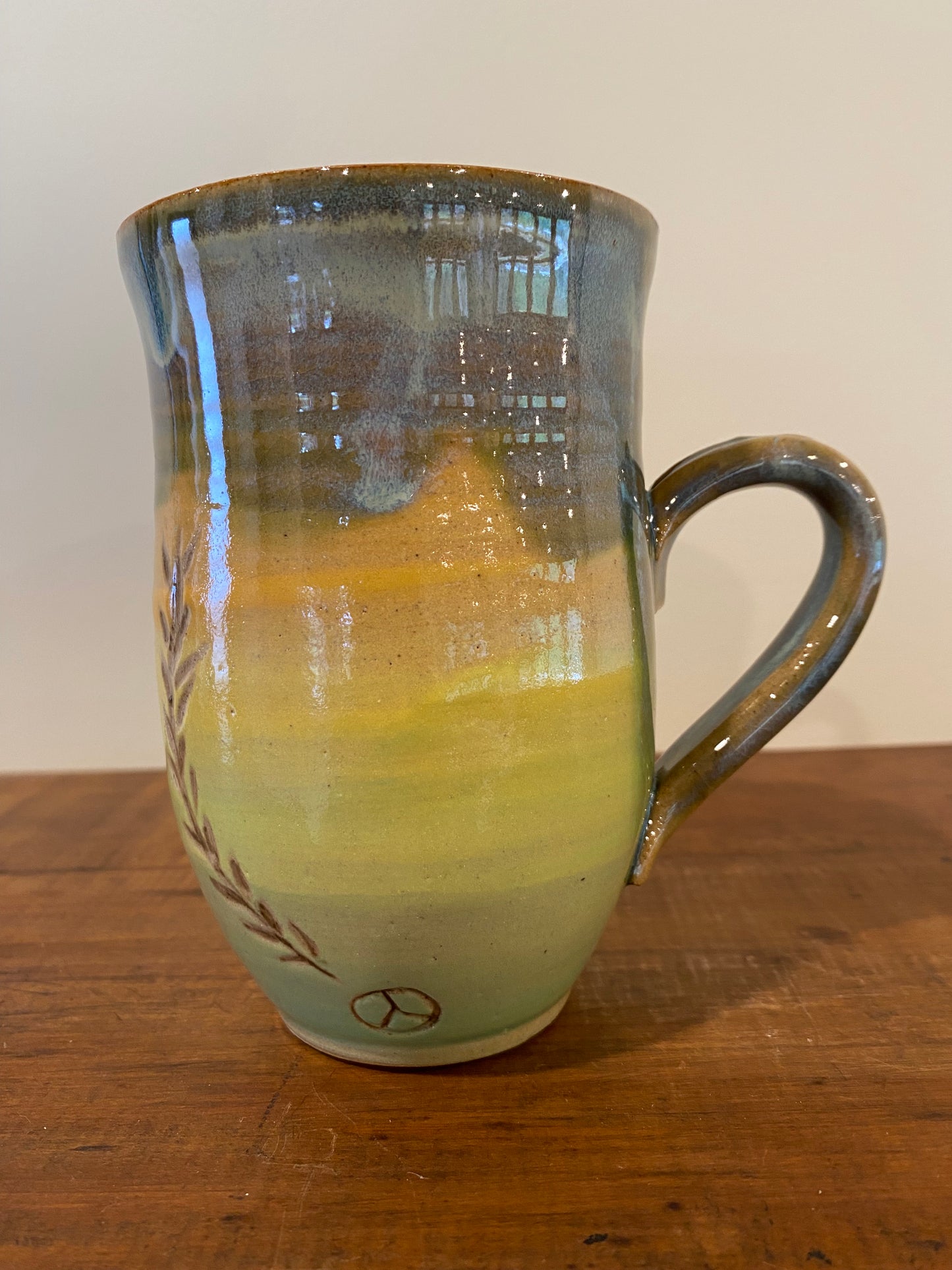 Leaf carved green mug